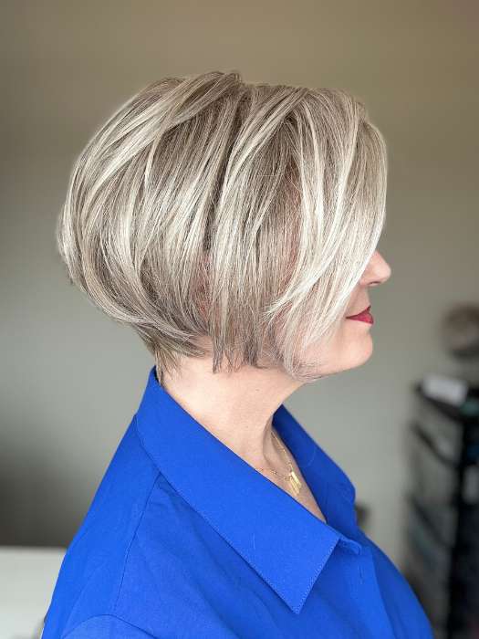 Mel B. @mels.be.ageless wearing IGNITE by JON RENAU in color 56F51 OYSTER | Light Grey with 20% Medium Brown Front, graduating to Grey with 30% Medium Brown Nape