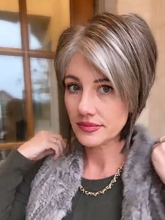 Jenny B. @thewiggygirl wearing REESE by NORIKO in color SANDY SILVER | Medium Brown Transitionally Blending to Silver and Dramatic Silver Bangs